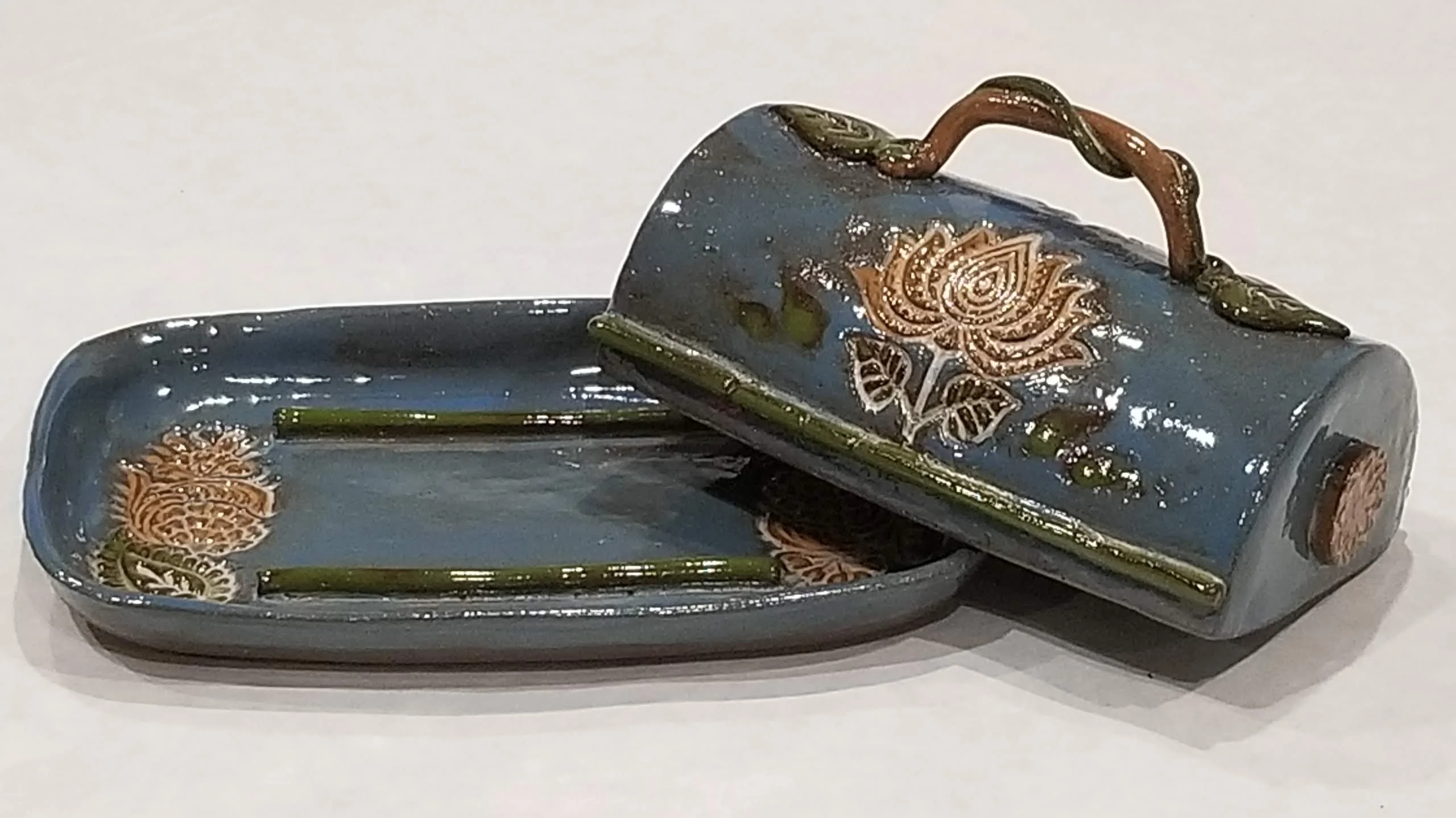 Handcrafted butter tray with decorative details